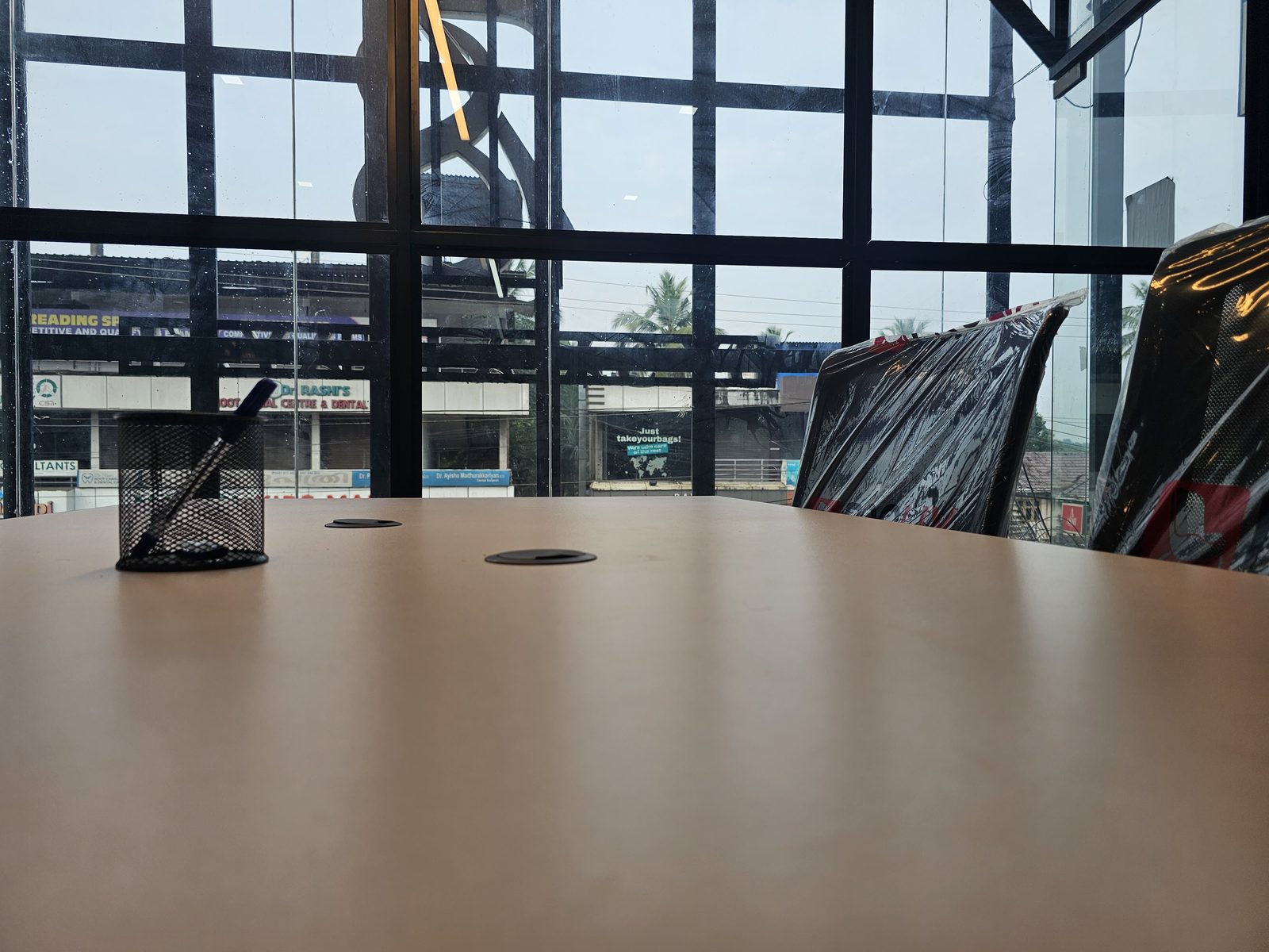 Meeting room with street view at Loginhub Coworks, Kondotty